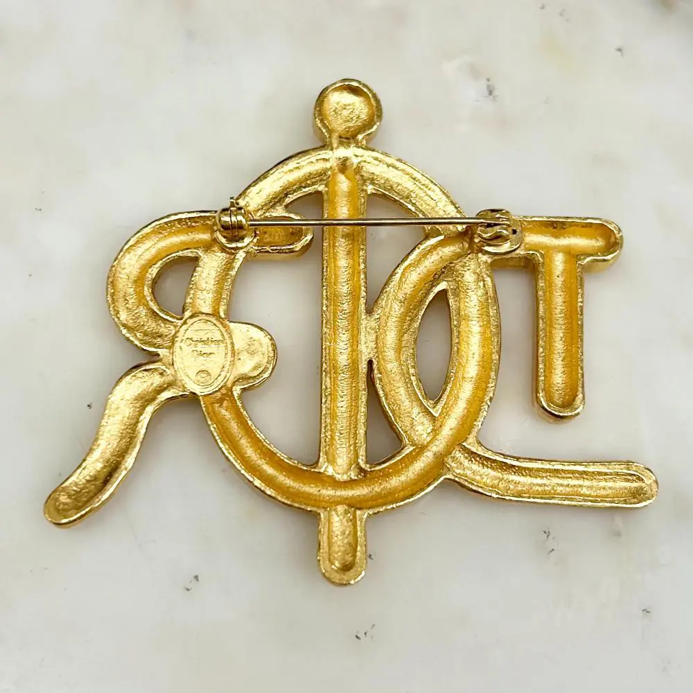 Dior 1980s gold rope effect brooch w/ clear crystal